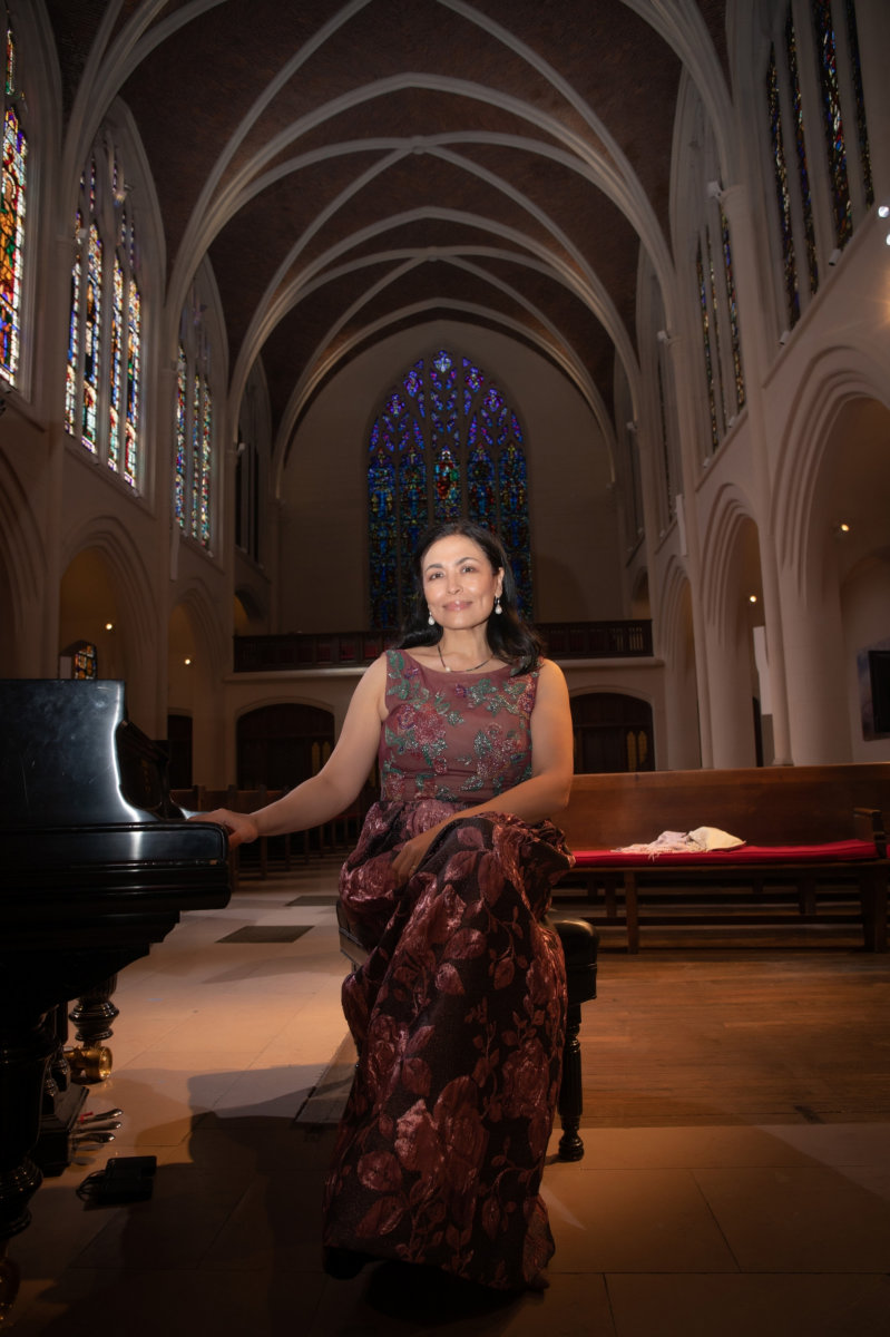 Kadi sitting posed Pianist Kadisha Onalbayeva